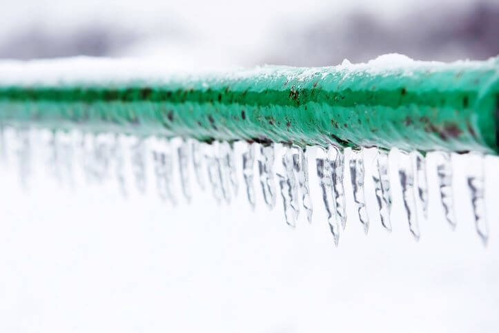 Frozen icy down pipe, icicles